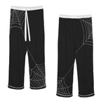 ANTIBrand black satin pajamas with white spiderweb print