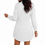 White dress with black bat polka dot pattern worn by a person on a white background