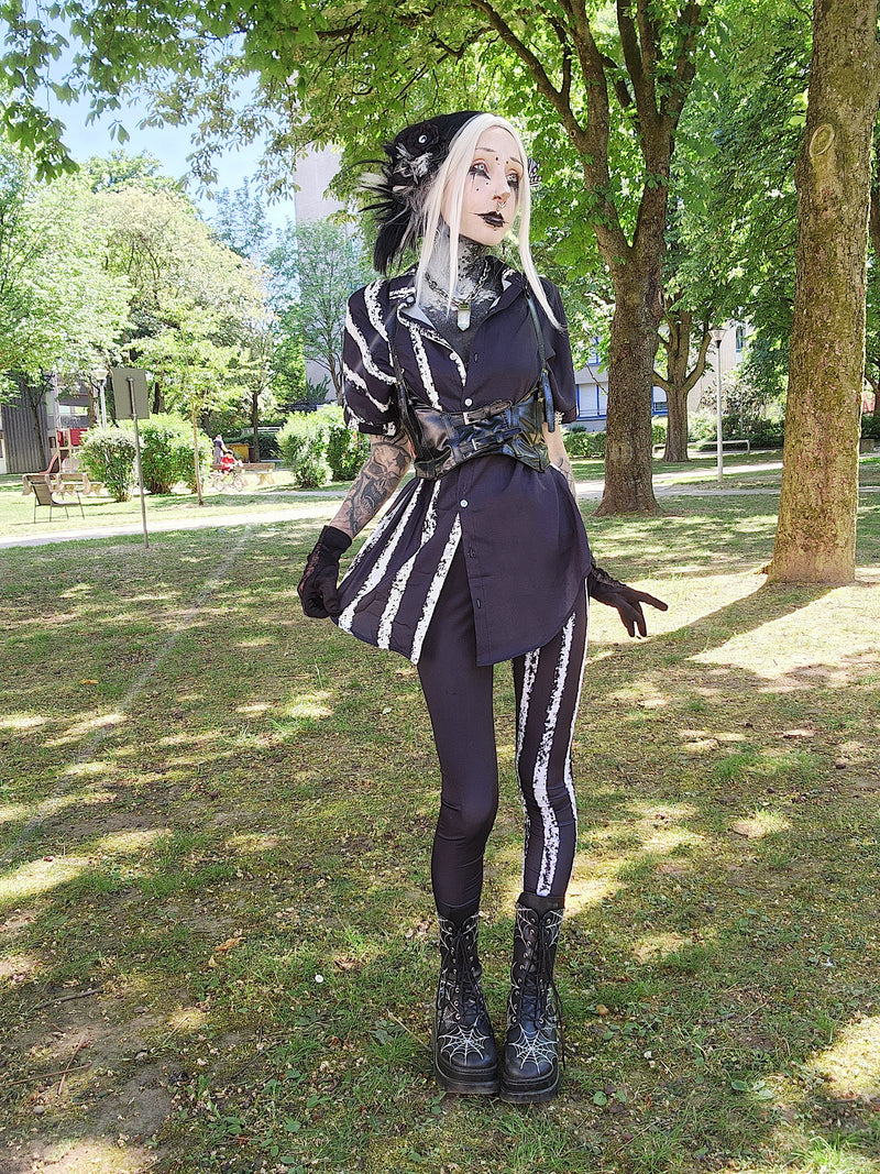 ANTIBrand White Stripes Done Right Duality Leggingson Valantinescorpse in a park