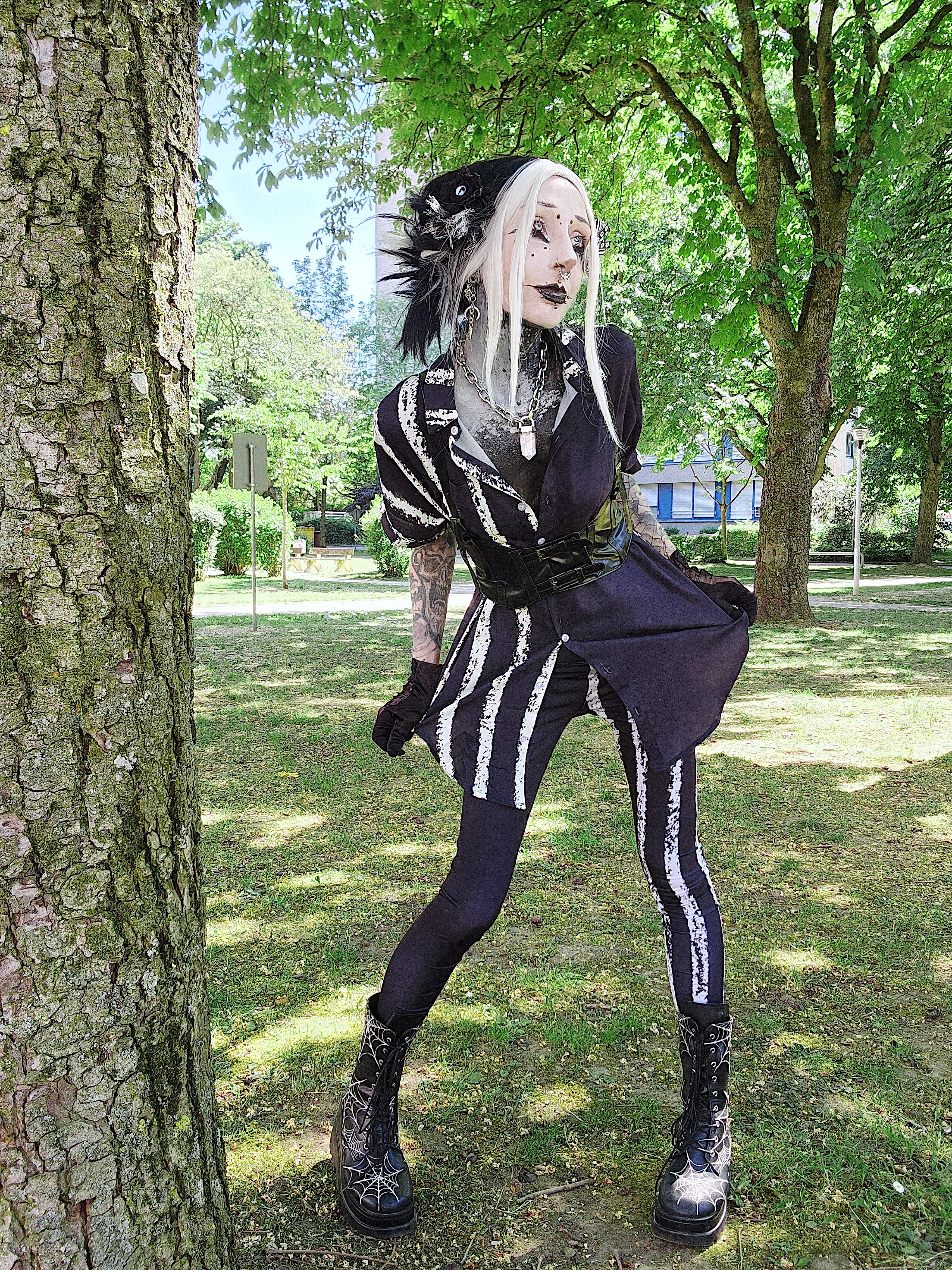 ANTIBrand White Stripes Done Right Duality Leggingson Valantinescorpse in a park setting